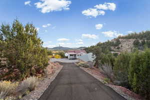 View of asphalt driveway featuring a mountain view