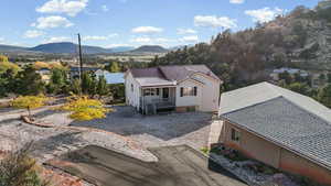 View of front of home featuring a metal roof and a deck with mountain view