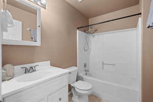 Full bathroom featuring vanity, shower / tub combination, and light tile patterned floors