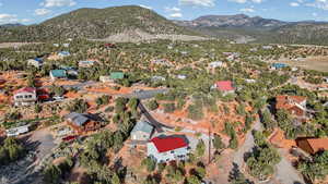 Aerial overview of property's location with a mountainous background