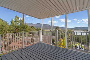 Wooden deck featuring a mountain view