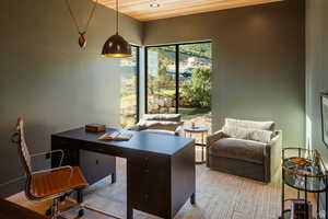 Home office featuring wood finished floors and wood ceiling