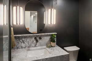 Bathroom with backsplash and vanity