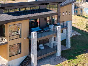 Wooden terrace featuring a patio area