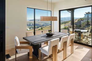 Dining room featuring light wood-style flooring and a mountain view