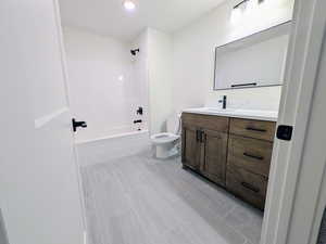 Full bath featuring vanity, bathing tub / shower combination, and recessed lighting