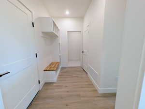 Mudroom featuring light wood-style floors and recessed lighting