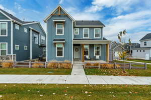 View of front of home featuring board and batten siding and a porch