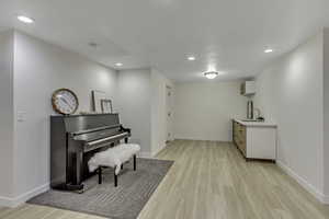 Sitting room featuring light wood-style floors and recessed lighting