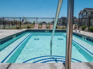 View of swimming pool with a patio area and a swimming pool