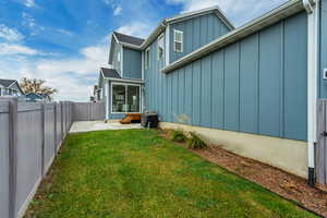 Fenced backyard with a sunroom