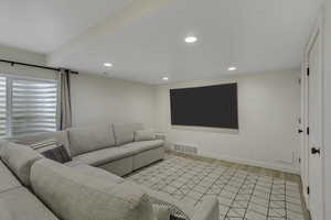 Living room featuring light wood-style flooring and recessed lighting