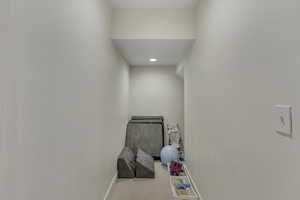 Laundry room with carpet floors and recessed lighting