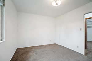Spare room featuring carpet floors