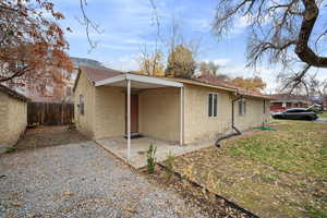 View of side of home featuring a patio