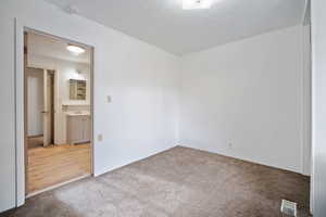 Unfurnished bedroom with carpet floors