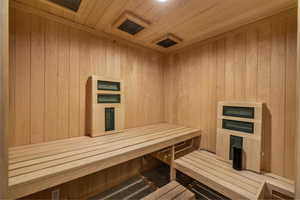 Sauna with wooden ceiling and wood walls