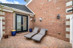 View of patio featuring french doors