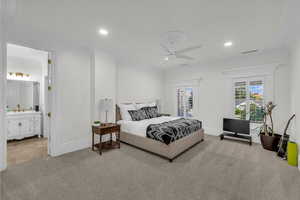 Bedroom with ornamental molding, carpet floors, a ceiling fan, recessed lighting, and ensuite bath
