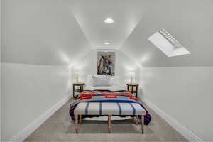 Bedroom with a skylight, light carpet, vaulted ceiling, and recessed lighting