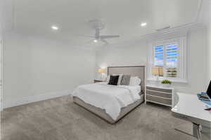 Carpeted bedroom featuring ornamental molding, ceiling fan, and recessed lighting