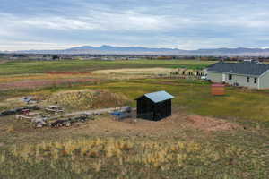 Overview of rural landscape featuring a mountainous background