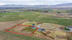 View of rural area with a mountain backdrop and property boundaries highlighted