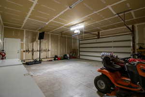 Garage featuring a garage door opener