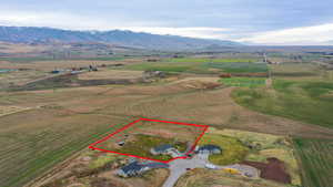 View of rural area with a mountainous background and property boundaries highlighted