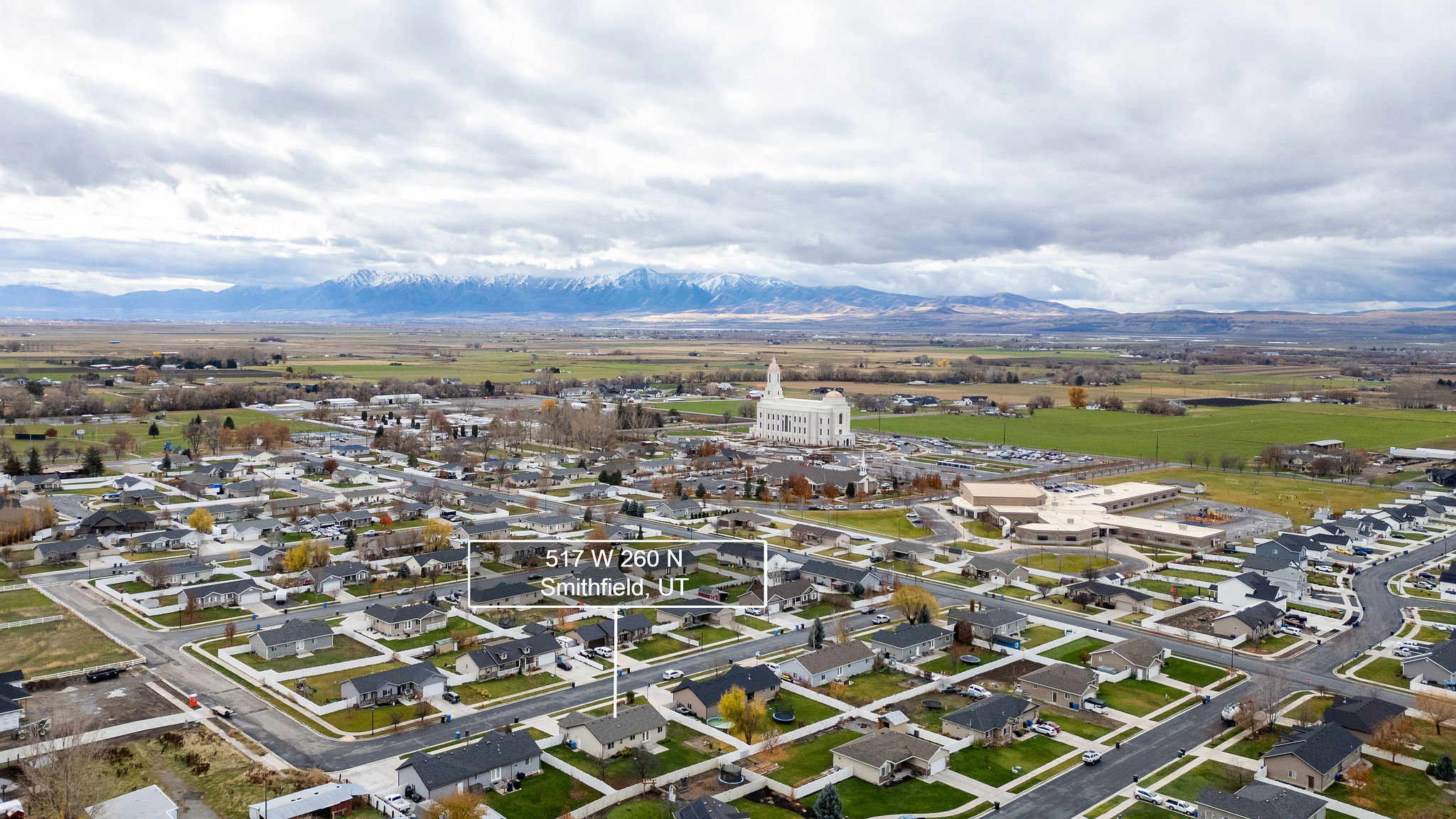 View of property location featuring nearby suburban area and a mountain backdrop