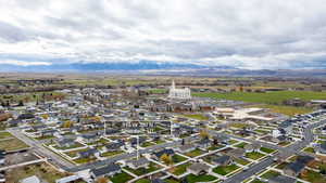 View of property location featuring nearby suburban area and a mountain backdrop