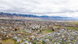 View of property location featuring a mountainous background and nearby suburban area
