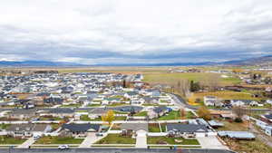 Aerial perspective of suburban area with a mountain backdrop