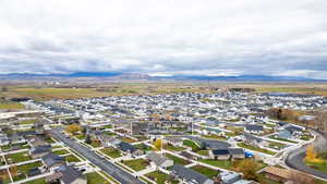 View of property location featuring nearby suburban area and a mountain backdrop