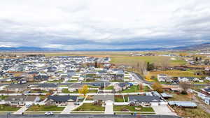 Aerial perspective of suburban area with a mountainous background