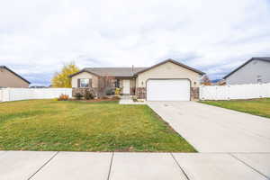 Ranch-style house featuring a gate, driveway, and a garage