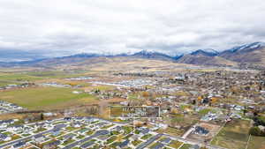 Aerial overview of property's location with nearby suburban area and a mountain backdrop