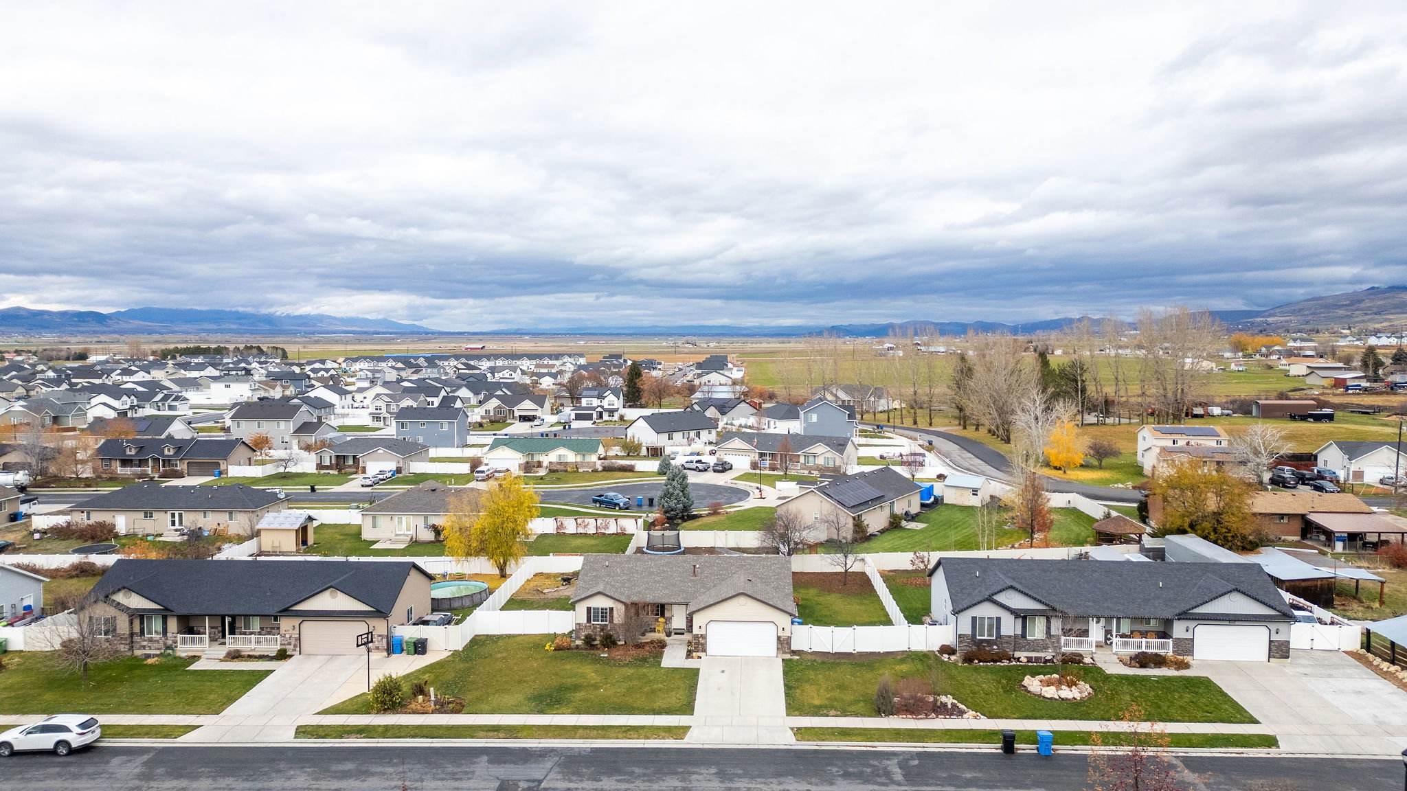 Aerial perspective of suburban area with a mountain backdrop