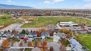 Aerial perspective of suburban area with a mountain backdrop