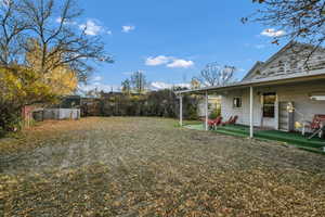 View of yard with covered porch