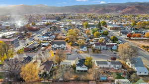 View of property location featuring nearby suburban area and a mountain backdrop