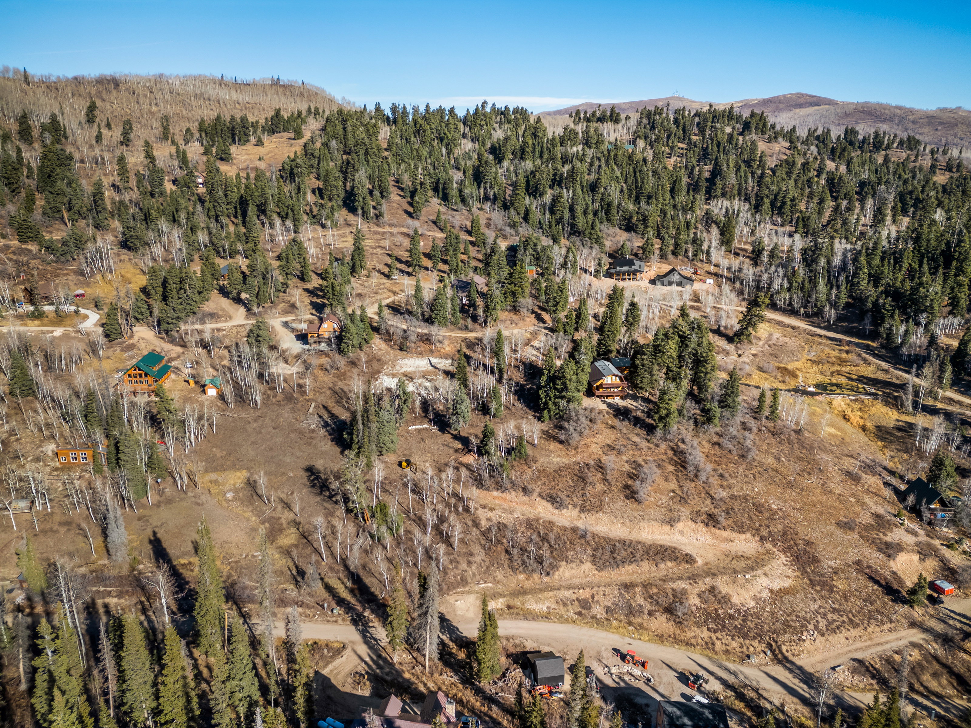 View of property location featuring a forest and a mountain backdrop