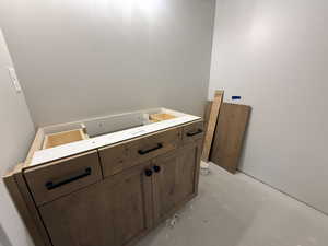 Bathroom with concrete flooring