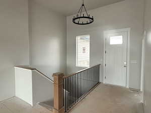 Foyer entrance featuring a chandelier