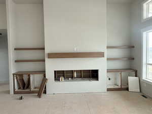 Unfurnished living room with a fireplace