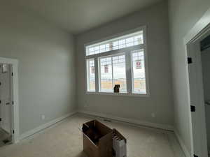 Spare room featuring baseboards