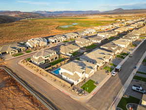View of property location with mountains and nearby suburban area