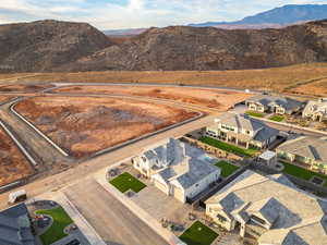 Aerial view of residential area featuring a mountainous background