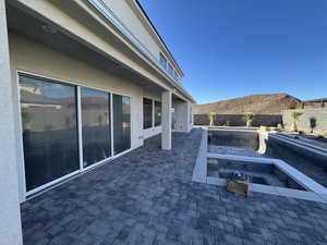 Fenced backyard with a patio area and a mountain view