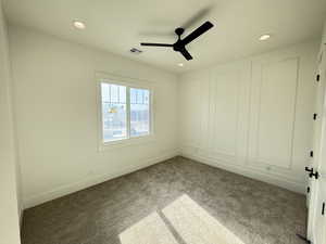 Unfurnished bedroom with carpet, ceiling fan, and recessed lighting